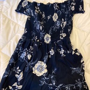 Blue romper  with flowers on it , size M